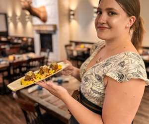 Sophie and her fellow waitstaff are ready to serve you delicious food! 